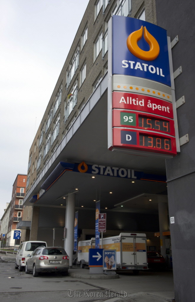 A sign displays the price in kroner of unleaded and diesel fuels at a gas station, operated by Statoil Fuel & Retail ASA in Oslo, Norway.  Bloomberg
