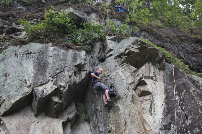 A climber works on a climbing fixture. KOTRi