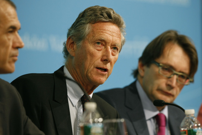 Chief economist for the International Monetary Fund Olivier Blanchard (center) speaks during a press conference at the headquarters of the IMF in Washington, D.C., Monday.     Xinhua-Yonhap News