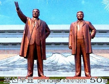 A commemorative postal stamp showing statues of former North Korean leaders Kim Il-sung (left) and Kim Jong-il (Yonhap News)