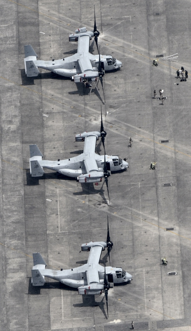 Three MV-22 Osprey sit on the tarmac at U.S. Marine Corps Air Station Iwakuni in Iwakuni, Yamaguchi Prefecture, western Japan, Monday.  AP-Yonhap News