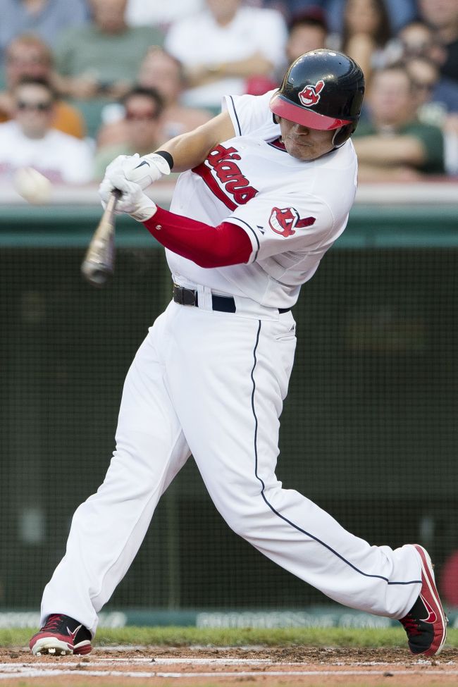 Indians outfielder Choo Shin-soo belts a two-run home run in the third inning on Monday.  AFP-Yonhap News