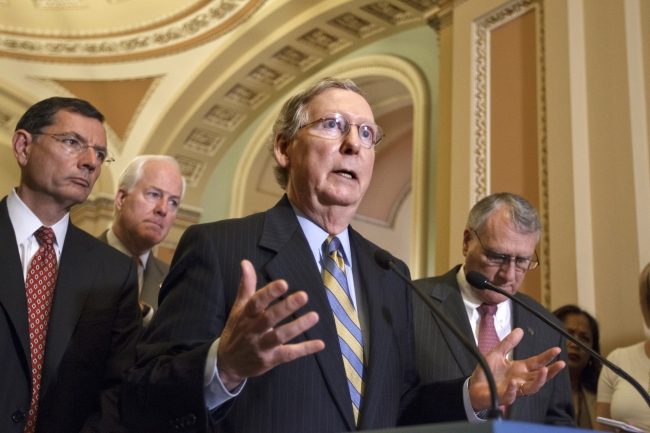 Senate Minority Leader Mitch McConnell (center) gestures during a news conference on Capitol Hill in Washington on Wednesday.  AP-Yonhap News