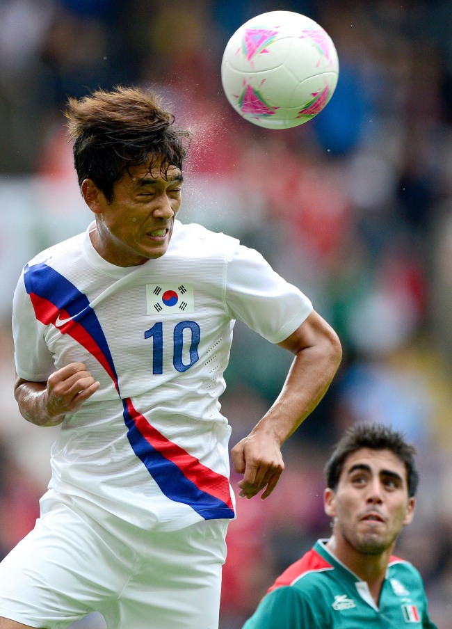 Korea’s Park Chu-young rises for a header against Mexico.  London Olympic Joint Press Corps