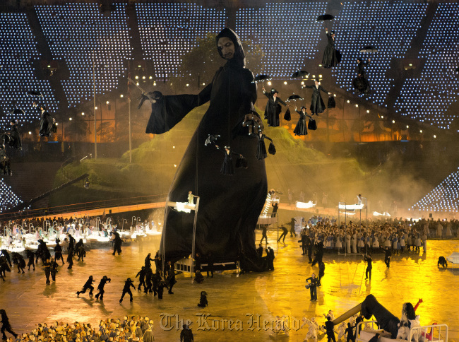 A tribute to Britain's National Health Service is performed during the Opening Ceremony at the London 2012 Summer Olympic Games on Saturday. Many "Mary Poppins" characters are dropping from the sky to save countless children from death and disease. (UPI-Yonhap News)