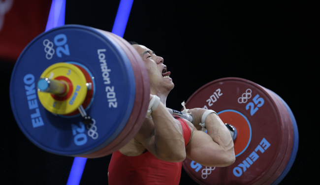 North Korea’s Om Yun-chol attempts a lift during the weightlifting competition on Sunday.  AP-Yonhap News