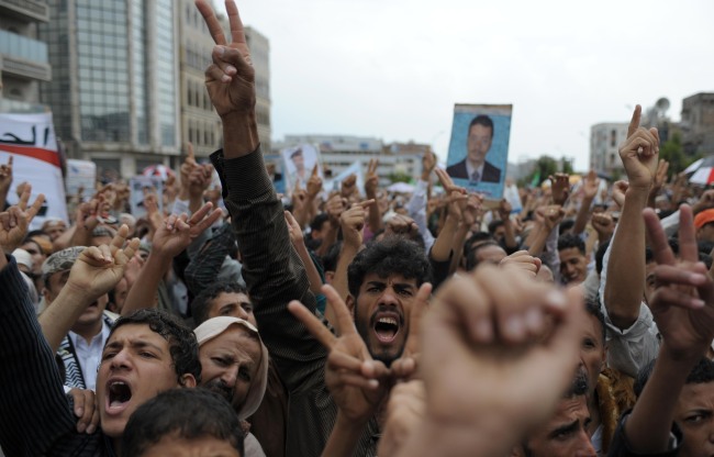 Yemenis shout slogans during a protest in the capital of Sanaa.  Xinhua-Yonhap News