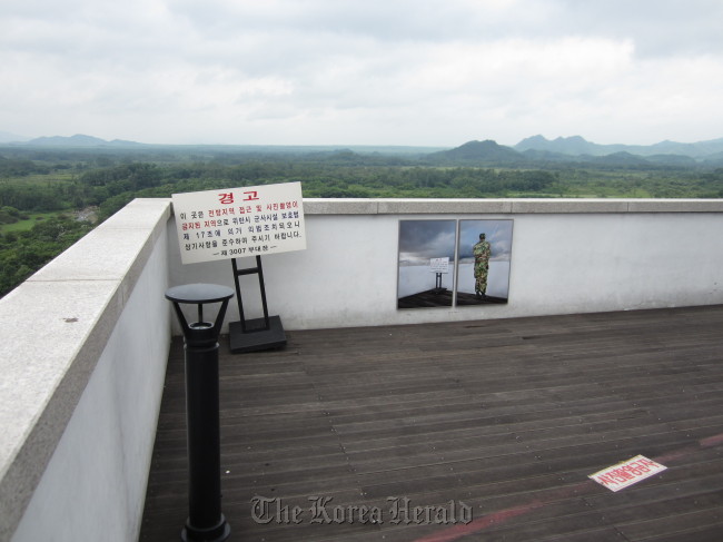 “To Survive vs. Once Arrived” by Suntag Noh is posted on the wall of a look-out spot at Cheorwon Peace Observatory. Samuso