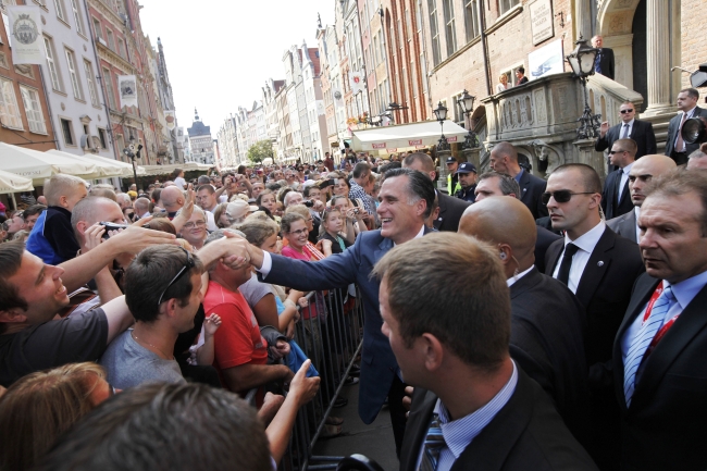 Republican presidential candidate, former Massachusetts Gov. Mitt Romney greets the crowd after meeting with Poland’s Prime Minister Donald Tusk at The Gdansk Old Town Hall, in Gdansk, Poland, Monday.  AP-Yonhap News