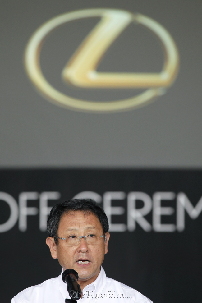 Akio Toyoda, president of Toyota Motor Corp., speaks during a line-off ceremony for the company’s Lexus ES series sedans on July 6.   Bloomberg