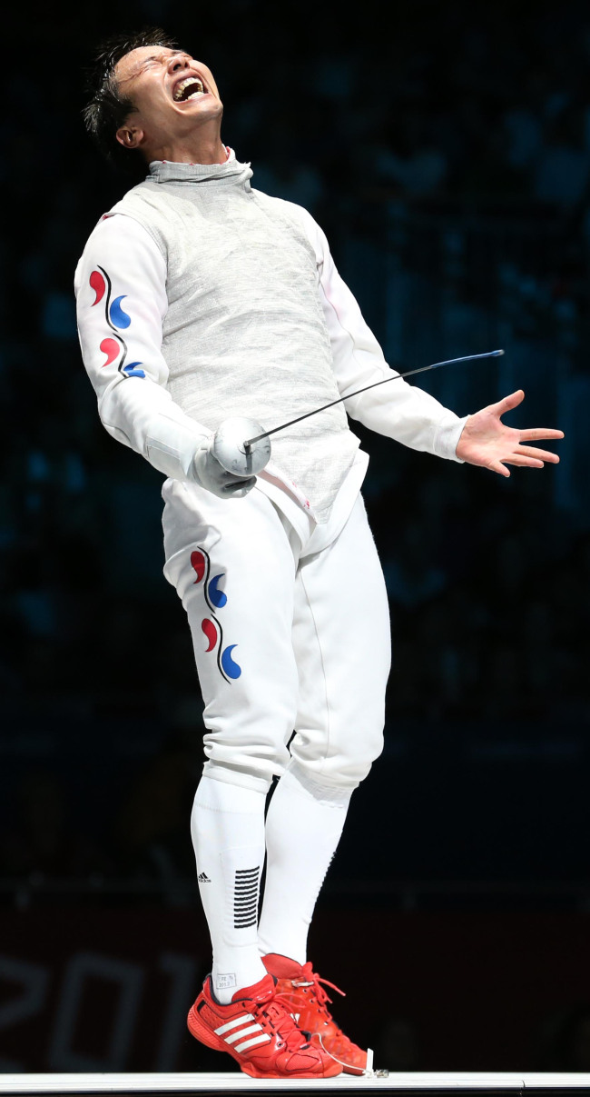 Korea’s Choi Byung-chul celebrates his bronze-medal victory.
London Olympic Joint Press Corps