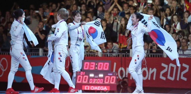 Football team shocks Britain; fencers gets real medal