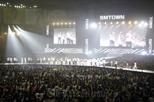 Fans cheer for the signers of S.M. Entertainment at the “SM Town Live World Tour III in Tokyo” concert held during the weekend at Tokyo Dome.  S.M. Entertainment