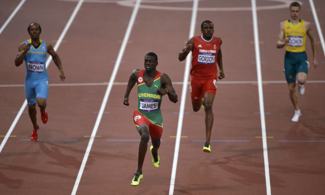 <YONHAP PHOTO-0567> Grenada's Kirani James wins the men's 400-meter final during the athletics in the Olympic Stadium at the 2012 Summer Olympics, London, Monday, Aug. 6, 2012.(AP Photo/Martin Meissner)/2012-08-07 06:33:20/ <저작권자 ⓒ 1980-2012 ㈜연합뉴스. 무단 전재 재배포 금지.>
Grenada’s Kirani James crosses the finish line during the 400-meter final.  AP-Yonhap News