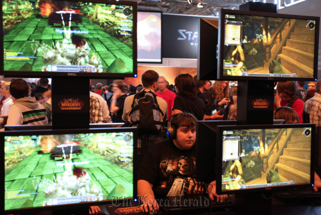 Visitors play Blizzard’s “World of Warcraft” video game at a previous gamescom video game trade fair in Cologne, Germany.  Bloomberg
