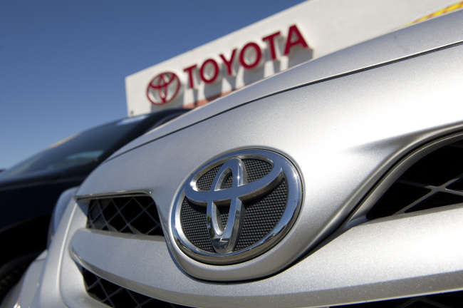Toyota Motor Corp. signage is displayed at a dealership in Richmond, California.  Bloomberg