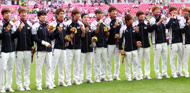 Footballer misses medal ceremony as officials investigate political act