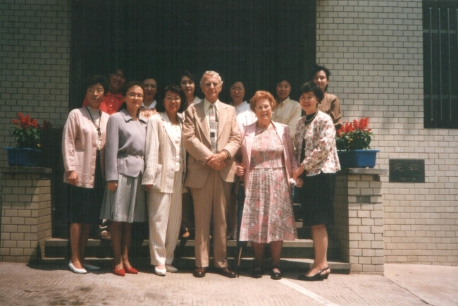 Peter van Lierop (center) poses in front of Aeranwon, a non-profit organization
for single women, with the staff during a visit circa 1994. Aeranwon