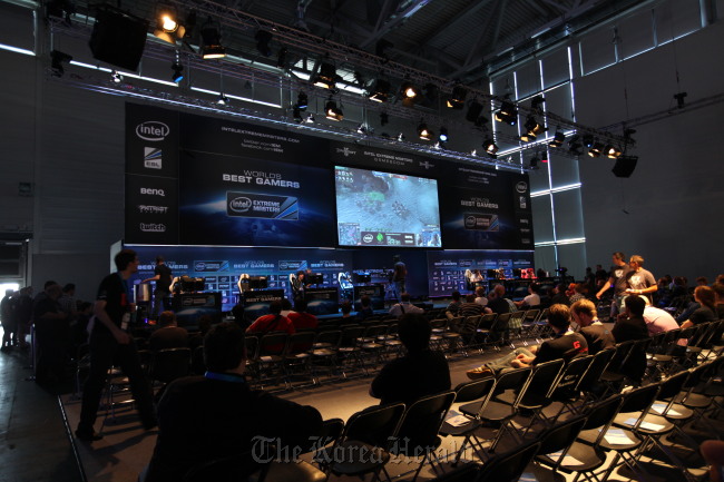 People take part in an event that selects the world’s best gamers launched at the gamescom convention in Cologne, Germany, on Thursday.   Nexon