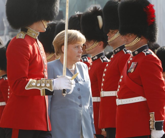 German Chancellor Angela Merkel inspects the Guard of Honor as she arrives on Parliament Hill in Ottawa on Thursday.   AP-Yonhap News
