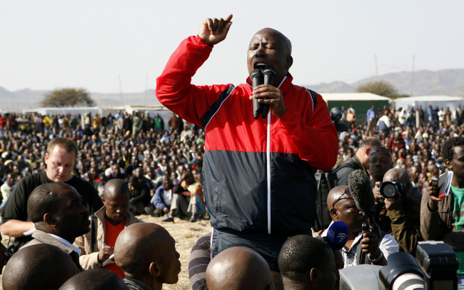 Former youth leader of the African National Congress Julius Malema addresses mine workers at the Lonmin mine near Rustenburg, South Africa, Saturday.   AP-Yonhap News