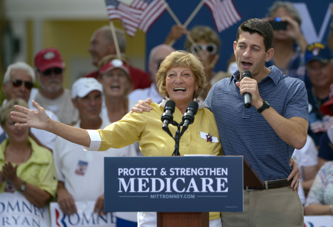 Republican vice-presidential candidate Rep. Paul Ryan (right) introduces his mother, Betty Ryan Douglas, to supporters at a campaign rally in The Villages, Florida on Saturday.   AP-Yonhap News