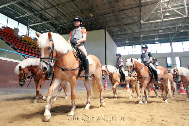 KRA’s Youth Riding Team take their horses out on a riding ground.   KRA