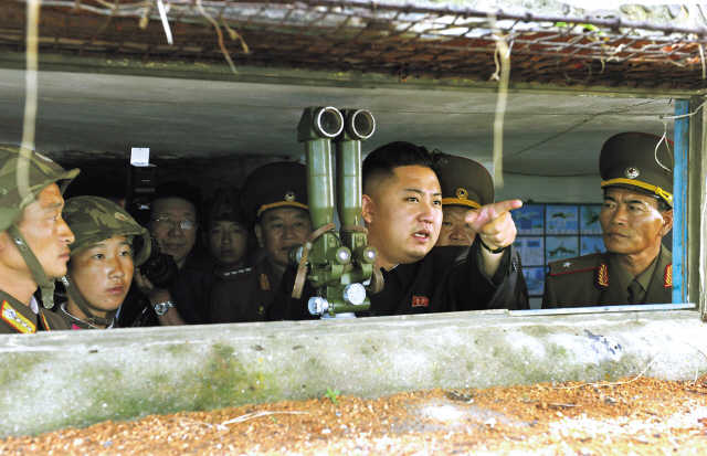 North Korean leader Kim Jong-un gestures as he inspects the island defense detachments stationed in the southernmost part of the southwest
front Saturday. The unit was responsible for the artillery attack on South Korea’s Yeonpyeong Island on Nov. 23, 2010. (Xinhua-Yonhap News)