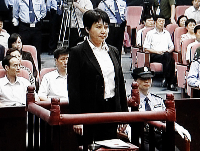 In this Aug. 9 file video image taken from CCTV, Gu Kailai (center), the wife of disgraced politician Bo Xilai, stands during her trial in the Hefei Intermediate People’s Court in Hefei in eastern China’s Anhui province.   AP-Yonhap News