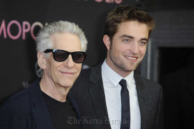 Director David Cronenberg (left) and actor Robert Pattinson attend the “Cosmopolis” Germany premiere at Cinema International, in Berlin, Germany on May 31.    MCT