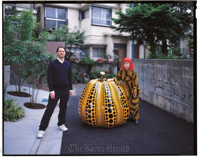 Marc Jacobs (left) and Yayoi Kusama in front of Kusama’s studio in Tokyo in 2006.   Louis Vuitton