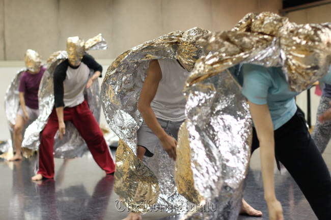 Dancers rehearse French choreographer Pierre Rigal’s upcoming show “Theatre of Operations.”   LG Arts Center