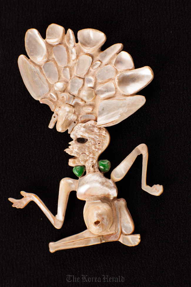 A shell ornament symbolizing the god of death found in Guatemala, 7th-8th century.   The National Museum of Korea