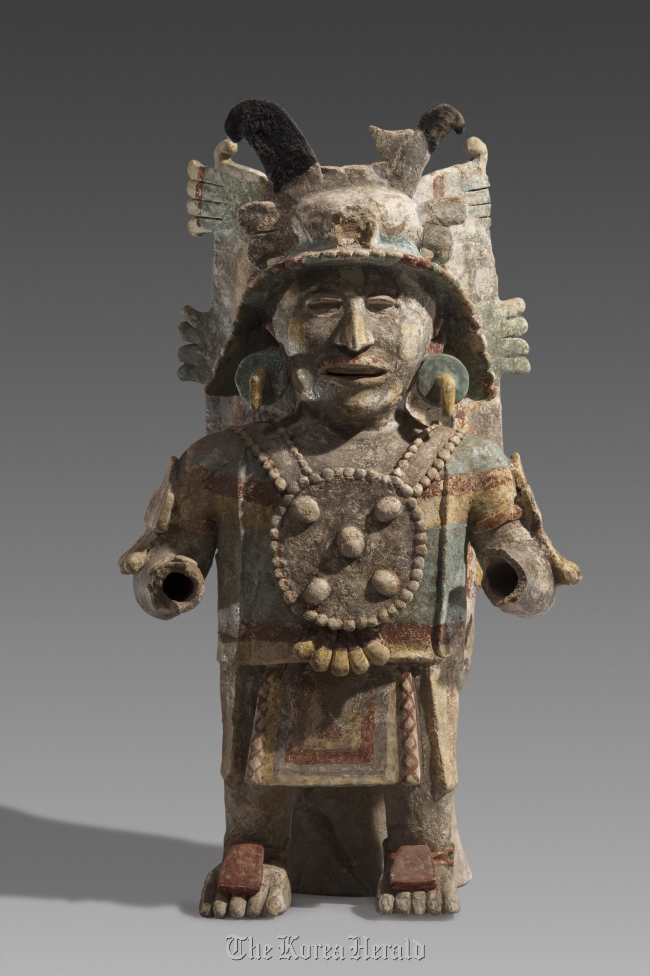 An 11th-15th century earthenware statue symbolizing the god of the sun found in Mexico.   The National Museum of Korea