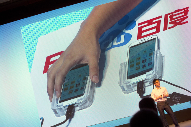 Smartphones are used to demonstrate Baidu Inc.’s new Internet browser at the company’s annual forum in Beijing on Monday.   Bloomberg