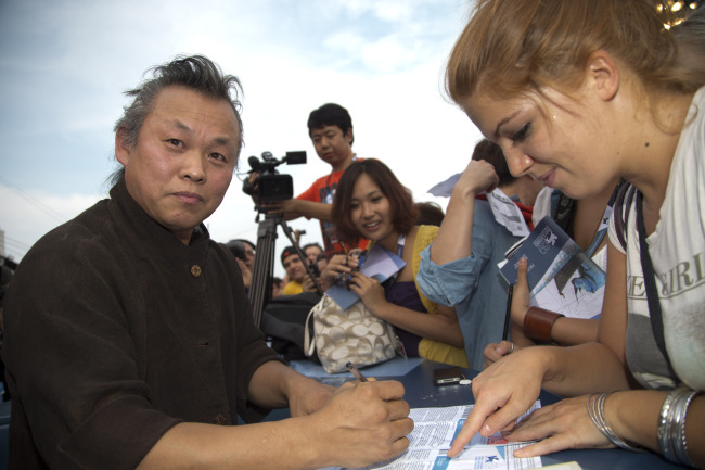 김기덕(영화감독)
South Korean director Kim Ki-duk brought his brand of excruciating emotion and troubling imagery to the Venice film festival Tuesday with his condemnation of extreme capitalism in “Pieta”.