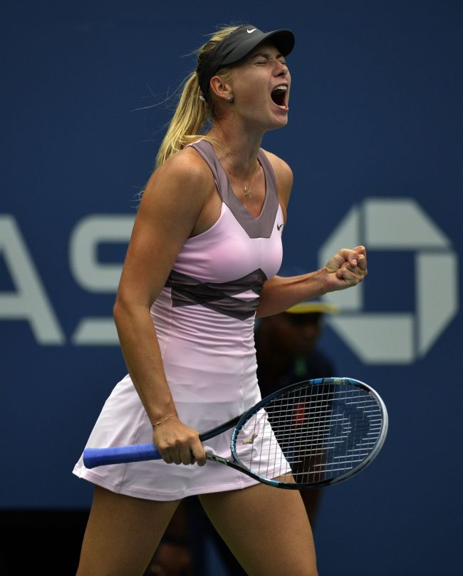 Maria Sharapova reacts to a point against Marion Bartoli on Wednesday.   AFP-Yonhap New