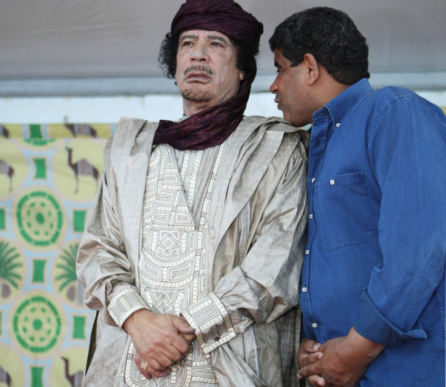 <YONHAP PHOTO-1896> FILE - In this Tuesday, Oct. 6, 2009 file photo, intelligence chief Abdullah al-Senoussi, right, whispers to Libyan leader Moammar Gadhafi in Sabha, Libya. A government statement read on national radio states that Mauritania has agreed to extradite Moammar Gadhafi's former spy chief, months after he tried to slip into Mauritania wearing a disguise and traveling on a fake passport. An official said Al-Senoussi is already on a plane headed to Libya. (AP Photo/Abdel Magid al-Fergany, File)/2012-09-05 19:31:15/ <저작권자 ⓒ 1980-2012 ㈜연합뉴스. 무단 전재 재배포 금지.>
In this  Oct. 6, 2009 file photo, intelligence chief Abdullah al-Senoussi (right) whispers to Libyan leader Moammar Gadhafi in Sabha, Libya.   AP-Yonhap News
