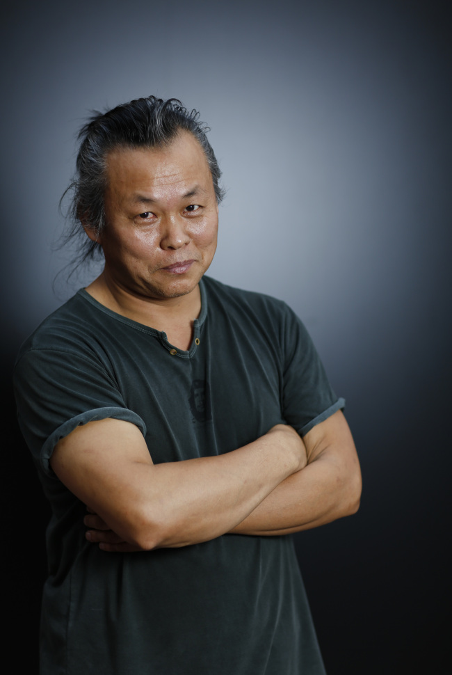 김기덕(영화감독)
<YONHAP PHOTO-0147> Director KIM Ki-duk poses for portraits at the 69th edition of the Venice Film Festival in Venice, Italy, Wednesday, Sept. 5, 2012. (AP Photo/Domenico Stinellis)/2012-09-06 05:13:31/ <저작권자 ⓒ 1980-2012 ㈜연합뉴스. 무단 전재 재배포 금지.>
Kim Ki-duk   Yonhap News