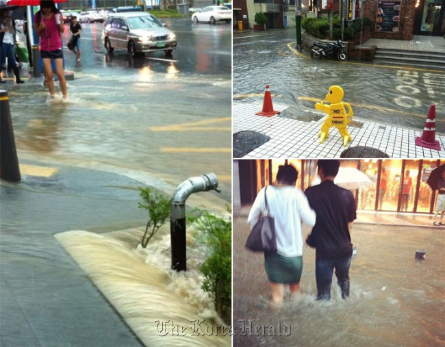 A Seoul street is flooded by heavy rain last month.   Yonhap News