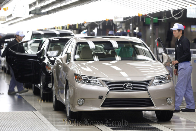 Employees make a final inspection of Toyota Motor Corp. Lexus ES sedans on the production line of the company’s Miyata plant in Japan.   Bloomberg