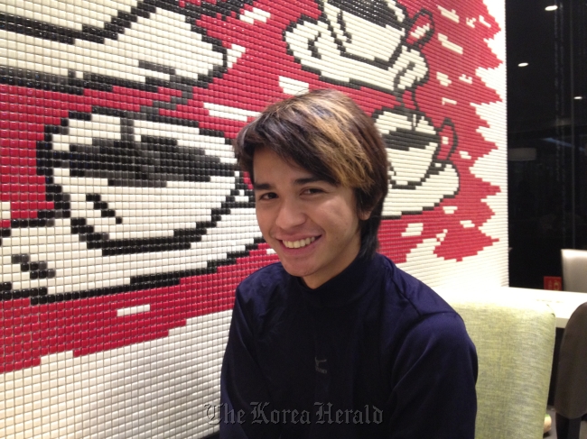Nash Ang, a Filipino exchange student at Korea National University of Arts, poses for a photo during an interview at a cafe in Seoul on Monday.   Philip Iglauer/The Korea Herald
