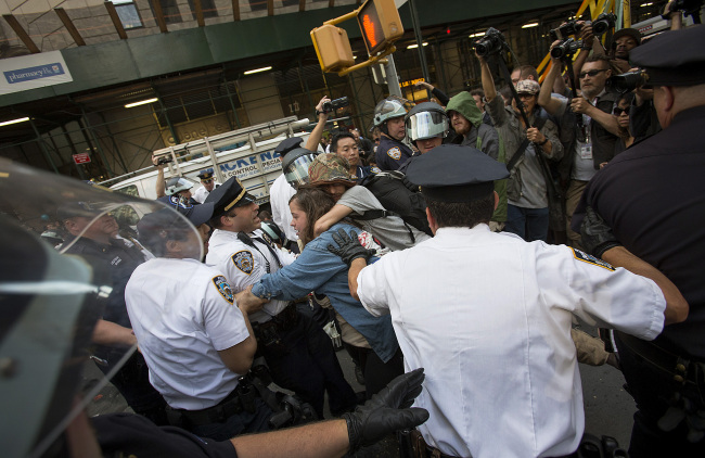 Officers with the New York City Police Department arrest protesters during an Occupy Wall Street demonstration in New York on Monday.   Bloomberg