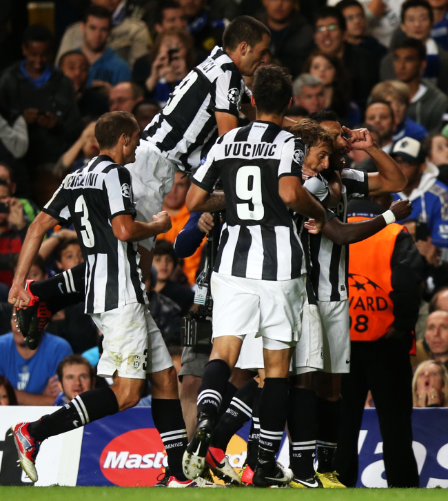 Juventus players celebrate their goal against Chelsea on Wednesday.   Xinhua-Yonhap News