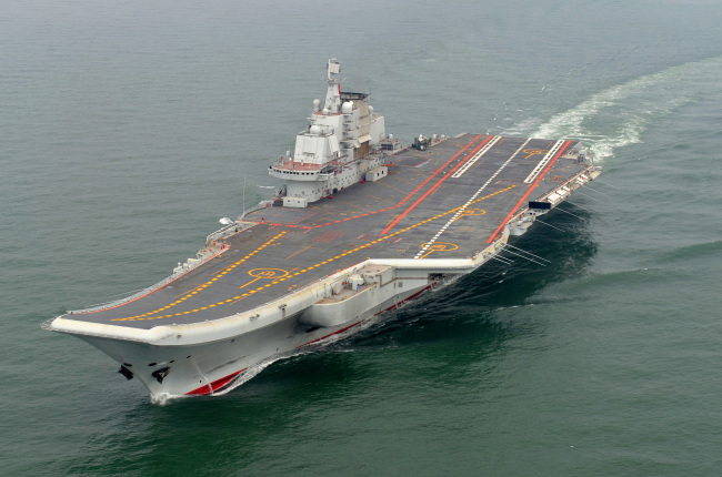 In this May 2012 photo provided by China’s Xinhua News Agency, Chinese aircraft carrier Liaoning cruises for a test on the sea.   AP-Yonhap News