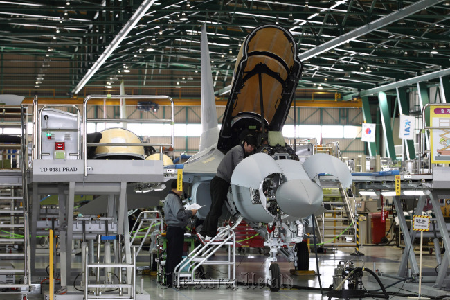 Employees work on a TA-50 trainer jet on the production line of the KAI plant in Sacheon, South Gyeongsang Province.   Bloomberg