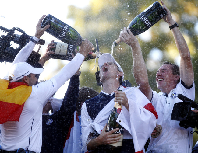 Team Europe’s Justin Rose is doused with champaign after Europe won the Ryder Cup.   UPI-Yonhap News