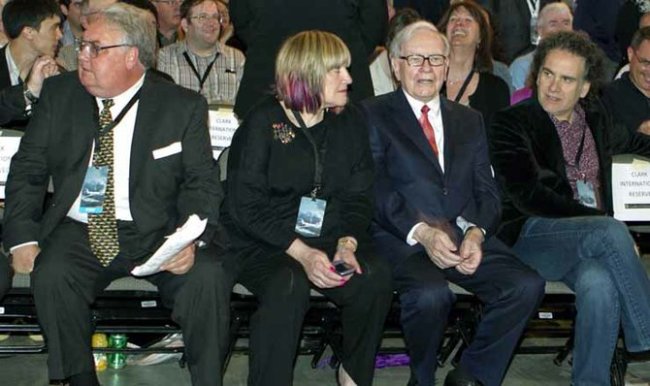 Berkshire Hathaway Chairman and CEO Warren Buffett (second from right) sits with his children (from left) Howard, Susie and Peter, at the Berkshire Hathaway shareholders meeting in Omaha, Nebraska, in April 2011.   AP