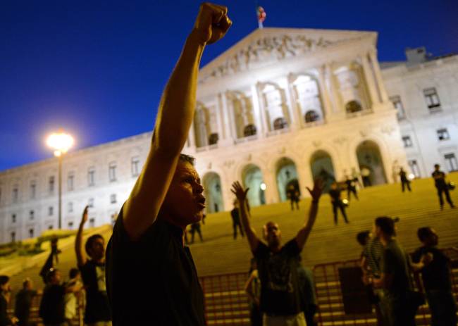 Protesters shout slogans during a demonstration in front of the parliament in Lisbon on Sept. 15.   AFP-Yonhap News
