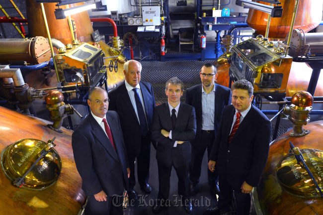 Martin Tangney (center) stands with other executive officials of Celtic Renewables during a visit at Tullibardine Whisky Distillery in Blackford Perthshire, Scotland.   Bloomberg